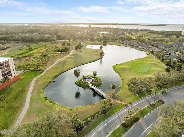 birds eye view of property featuring view of golf course and a water view