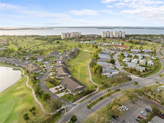 birds eye view of property featuring a water view and a residential view