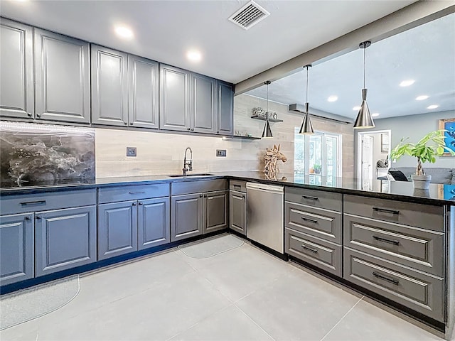 kitchen with tasteful backsplash, gray cabinets, visible vents, stainless steel dishwasher, and a peninsula