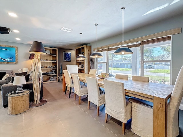 dining area with light tile patterned floors, visible vents, and recessed lighting