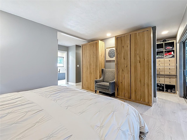 bedroom featuring light wood finished floors