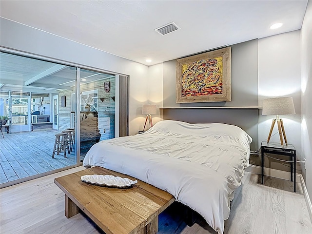 bedroom with recessed lighting, visible vents, wood finished floors, access to outside, and baseboards