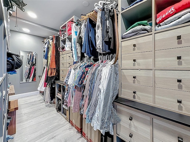 walk in closet featuring light wood-style floors