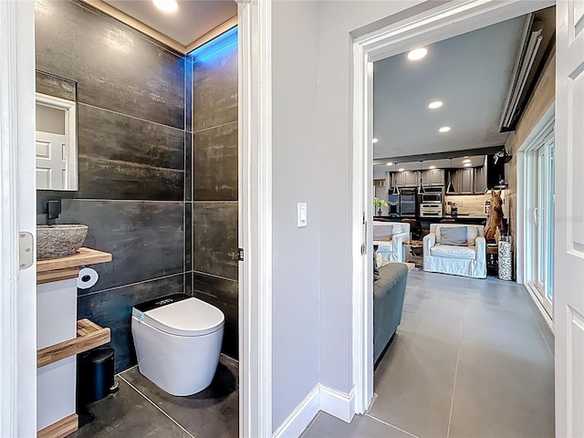 bathroom featuring toilet and recessed lighting