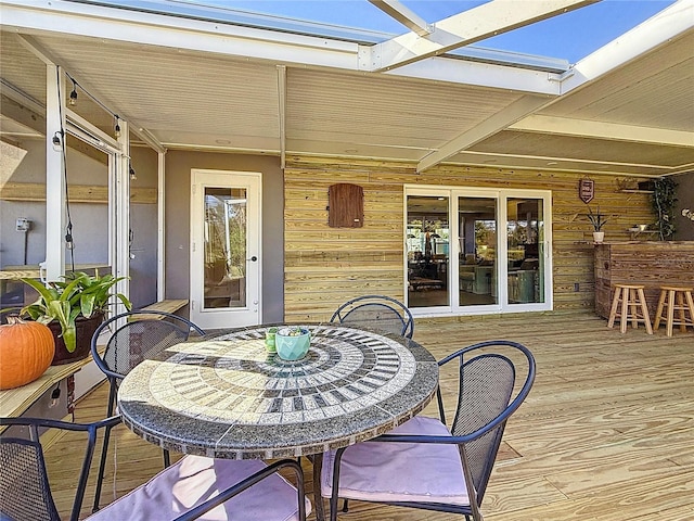 deck with outdoor dining area