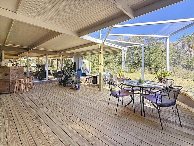 deck featuring outdoor dining space and a lanai