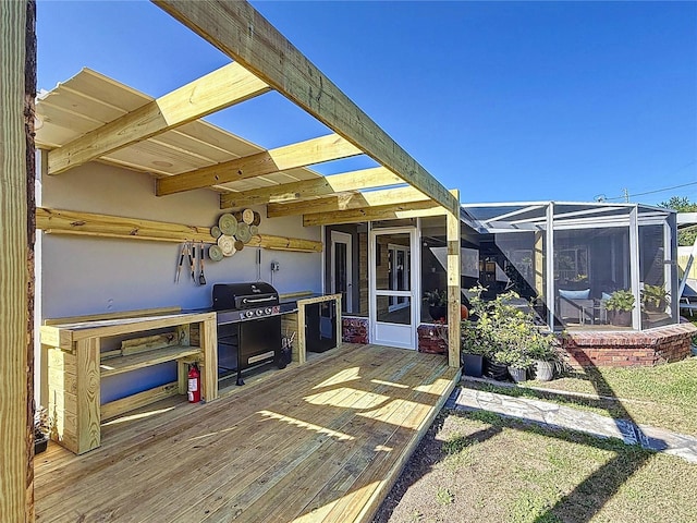 view of patio featuring a deck, grilling area, and a lanai