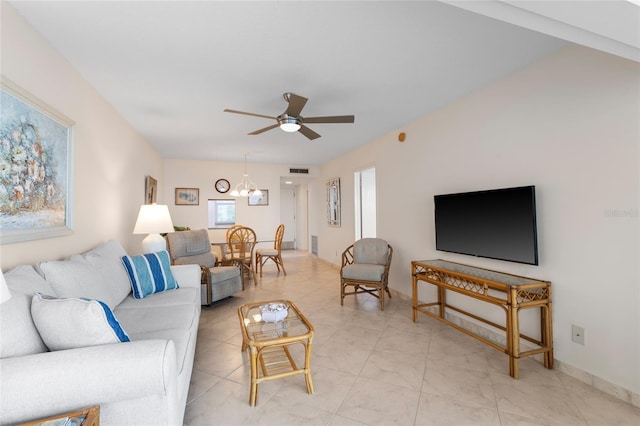 living room with light tile patterned flooring, ceiling fan with notable chandelier, and visible vents