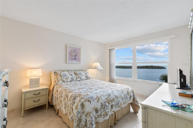 bedroom featuring light tile patterned floors