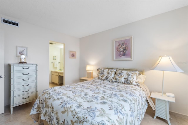 bedroom featuring visible vents and ensuite bathroom