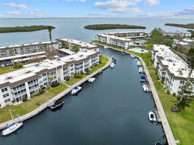 birds eye view of property with a water view