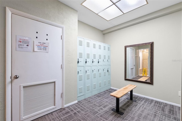 interior space featuring visible vents, baseboards, and carpet floors