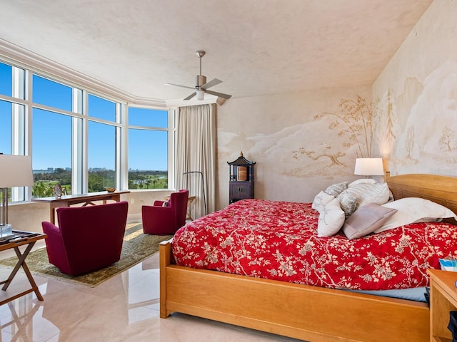 tiled bedroom featuring ceiling fan