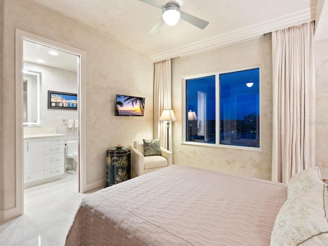 bedroom featuring ensuite bath, a ceiling fan, baseboards, and ornamental molding