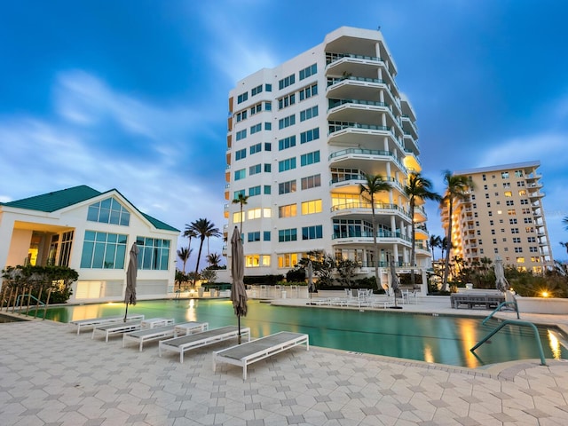 view of swimming pool with a water view