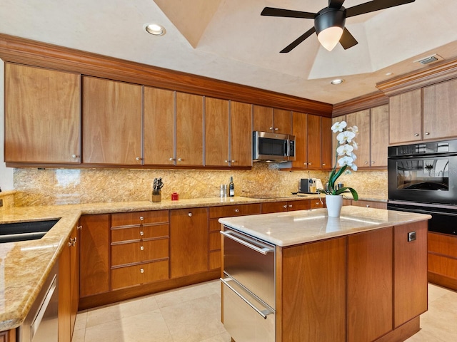 kitchen with a center island, backsplash, black appliances, and a warming drawer