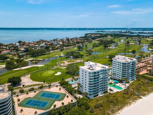 birds eye view of property featuring golf course view and a water view