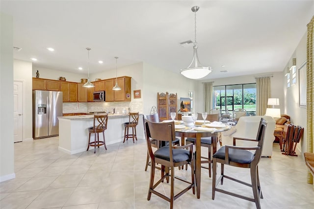 dining area with light tile patterned flooring, baseboards, visible vents, and recessed lighting