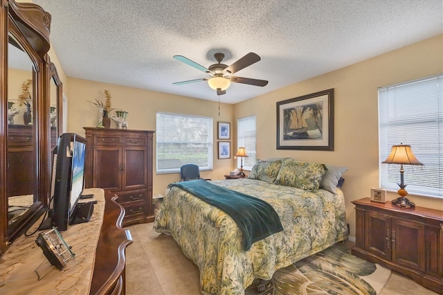 5614 Garden Lakes Dr, Bradenton, FL 34203 - bedroom featuring a ceiling fan and a textured ceiling