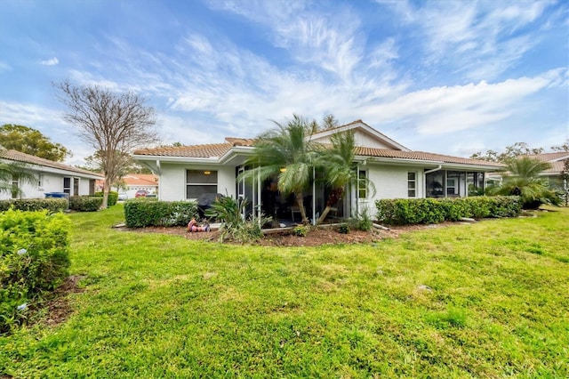 5614 Garden Lakes Dr, Bradenton, FL 34203 - view of front of home with a front lawn and a tiled roof