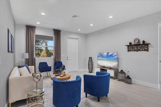 living room featuring recessed lighting, baseboards, and visible vents