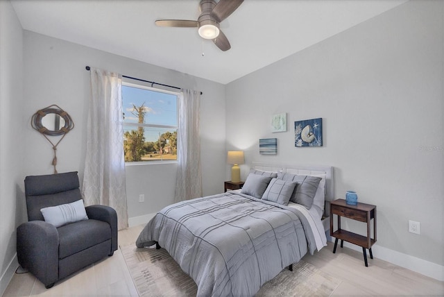 bedroom featuring ceiling fan and baseboards