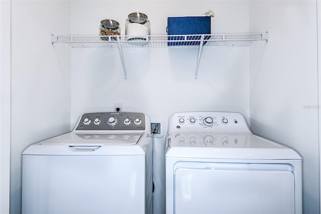 laundry area with laundry area and separate washer and dryer