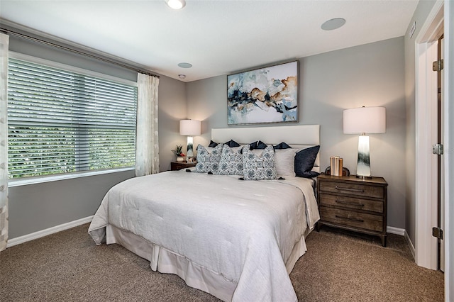 bedroom with carpet and baseboards