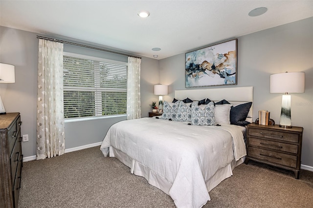 carpeted bedroom featuring baseboards