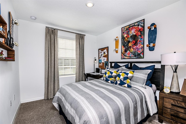 carpeted bedroom featuring baseboards