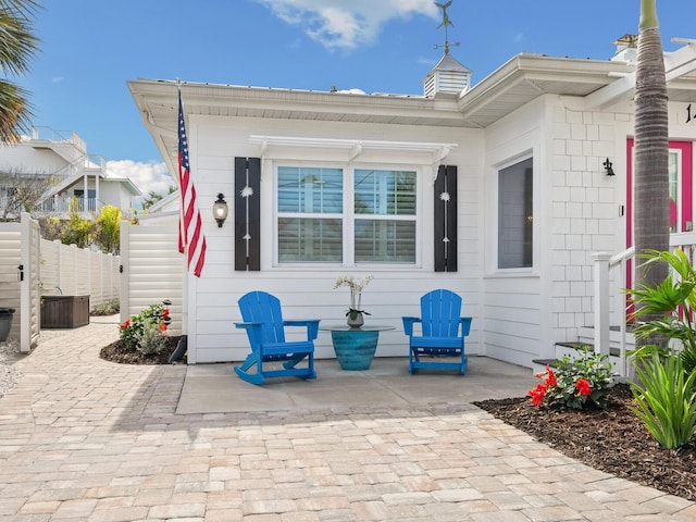 view of patio / terrace featuring fence