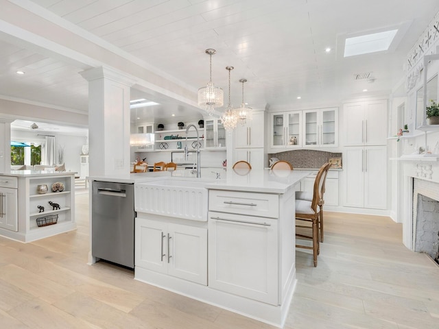 kitchen with white cabinetry, light countertops, stainless steel dishwasher, backsplash, and open shelves