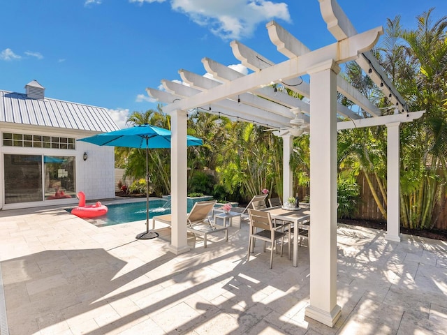 view of patio / terrace with outdoor dining space, an outdoor pool, fence, and a pergola