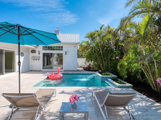 outdoor pool featuring a patio area