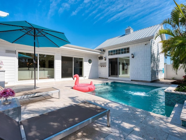 outdoor pool featuring a patio