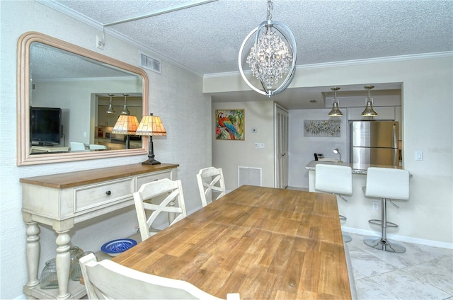 dining room featuring visible vents and crown molding