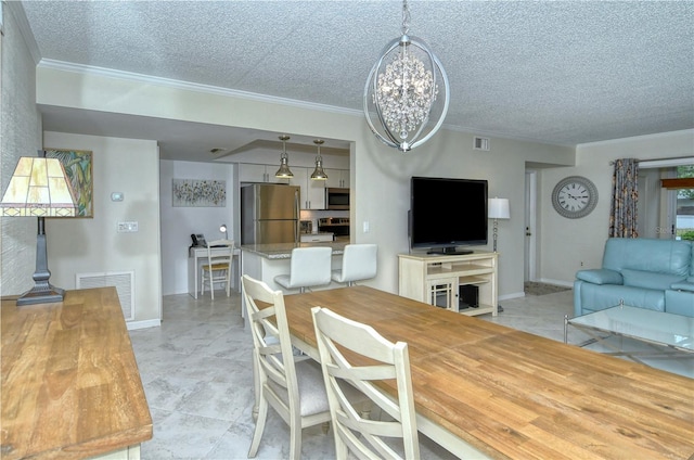 dining space featuring baseboards, visible vents, a textured ceiling, and ornamental molding