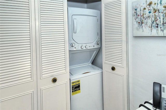 washroom with laundry area and stacked washer / dryer