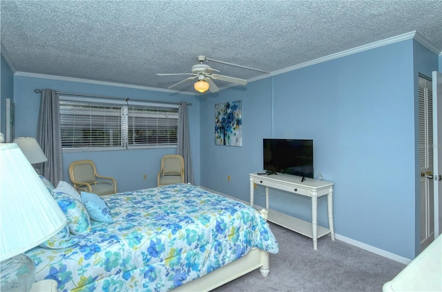 carpeted bedroom with a textured ceiling, ceiling fan, baseboards, and crown molding