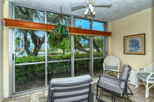 sunroom with ceiling fan