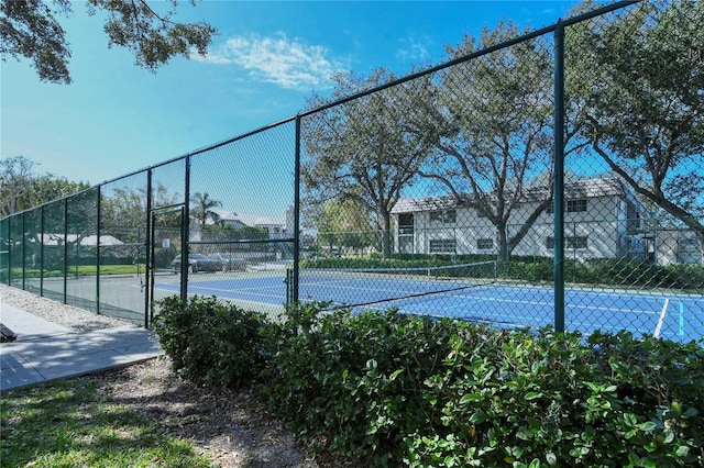 view of sport court with fence