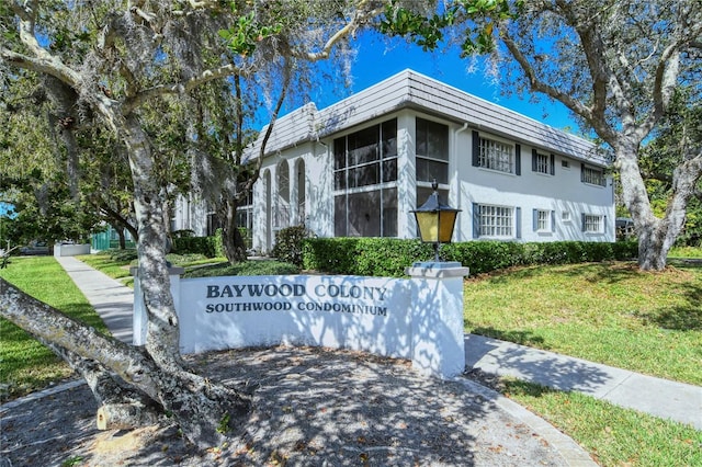 1711 Southwood St Unit 1711, Sarasota, FL 34231 - community sign featuring a lawn