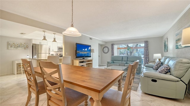 1711 Southwood St Unit 1711, Sarasota, FL 34231 - dining area with light tile patterned floors, ornamental molding, and visible vents