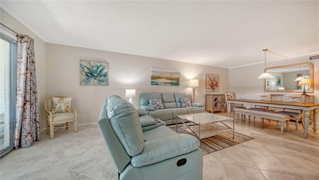 1711 Southwood St Unit 1711, Sarasota, FL 34231 - living room with crown molding, a textured ceiling, baseboards, and visible vents