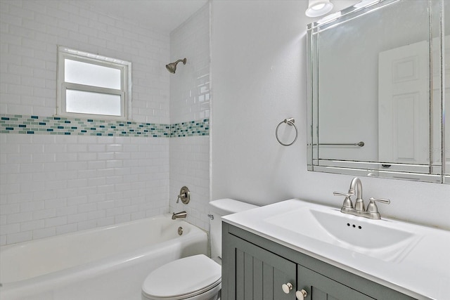 bathroom featuring shower / washtub combination, vanity, and toilet