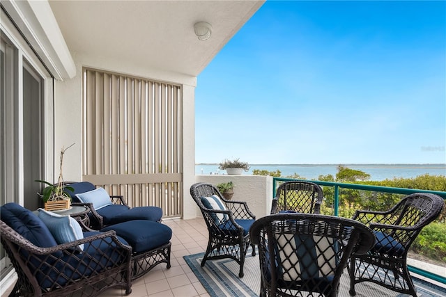 balcony featuring a water view