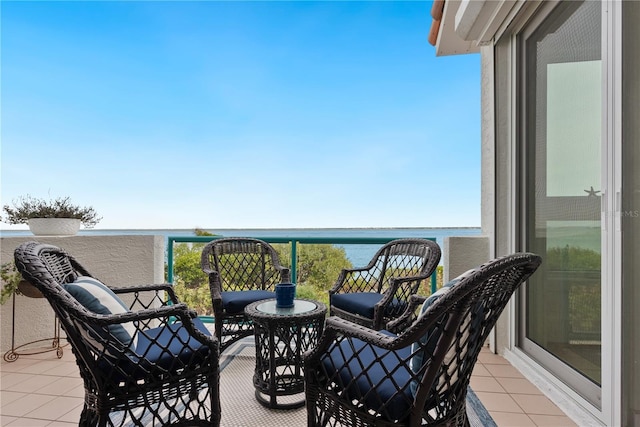 balcony featuring a water view