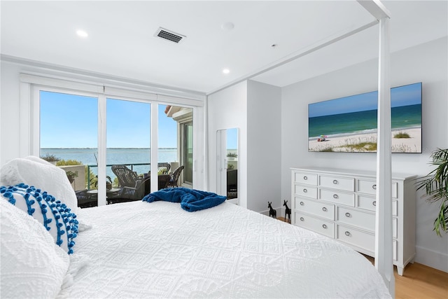 bedroom featuring recessed lighting, wood finished floors, and visible vents