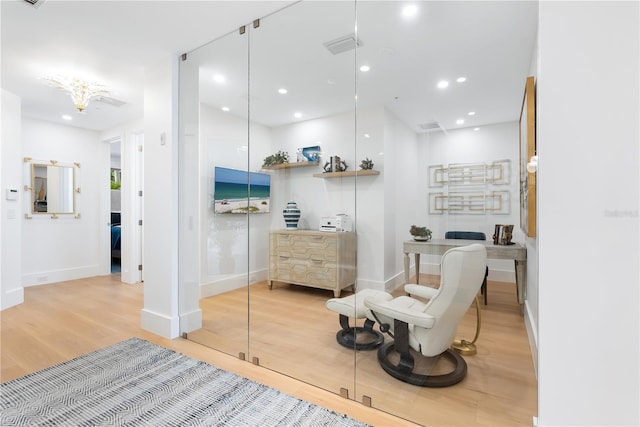 interior space with visible vents, recessed lighting, baseboards, and wood finished floors