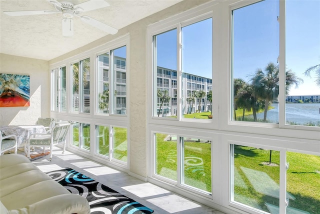 sunroom with a ceiling fan